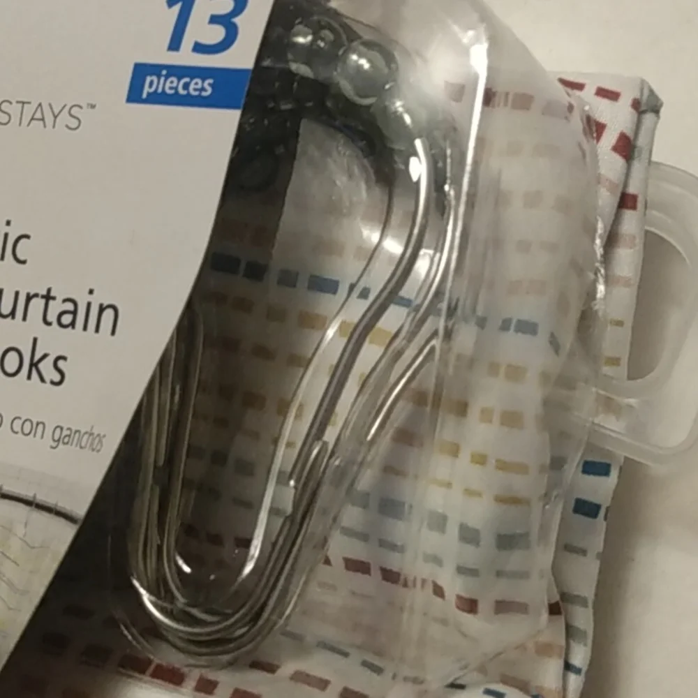Mainstays 13 piece lightweight fabric printed shower curtain with hooks.